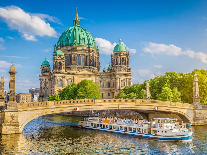 Beautiful view of historic Berlin Cathedral Berliner Dom at famous Museumsinsel Museum Island with excursion boat on Spr