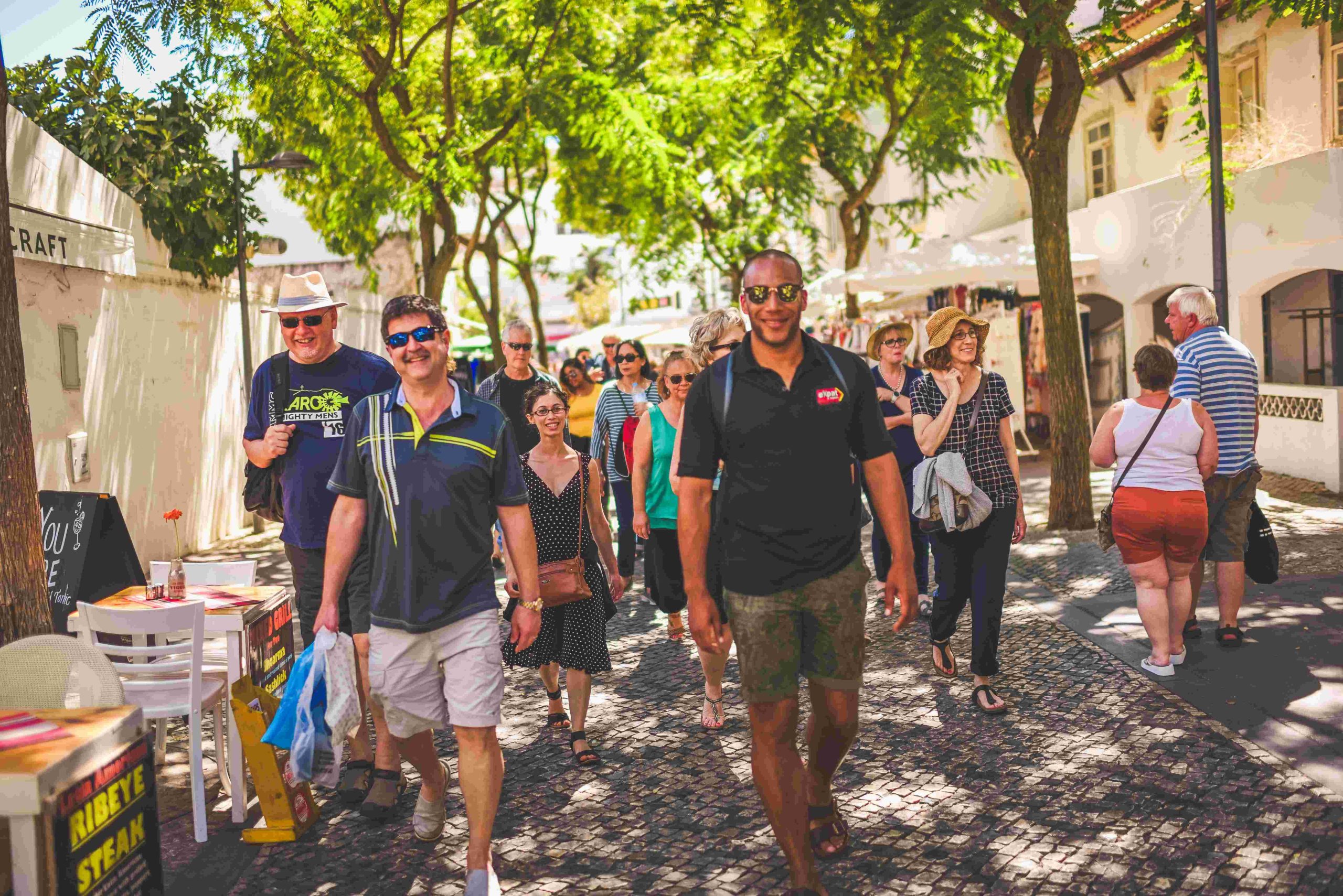 Tour group walking through historic street in Europe