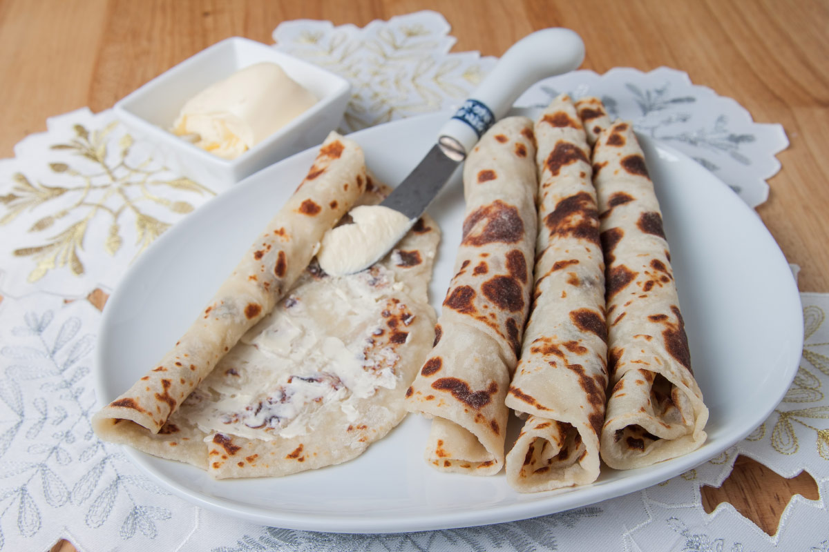 Lefse and butter on plate food bucket list
