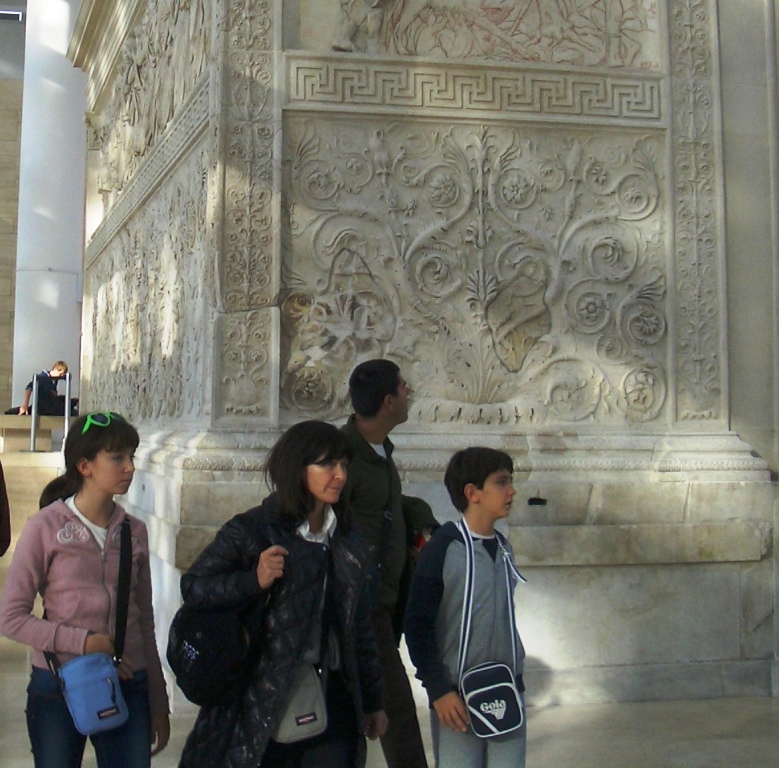 Family touring Ari Pacis Augustan Altar of Peace, Rome Italy 